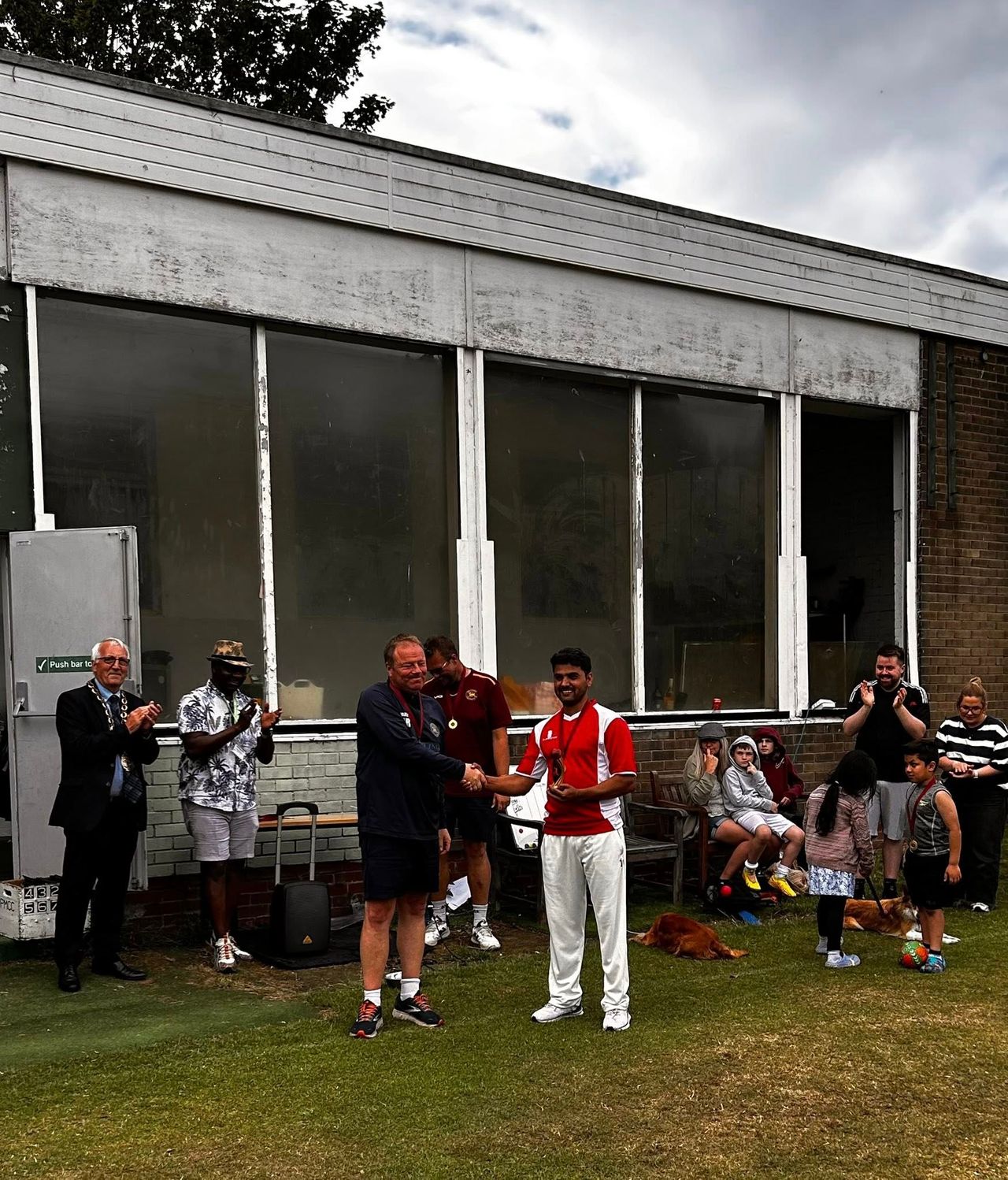 Club President Jon Roys awards the newly-christened Mashal-Roys trophy to winning skipper Akakhel Mashal
